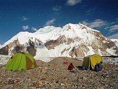 12 Shagring Camp On The Upper Baltoro Glacier With Baltoro Kangri We camped at Shagring (4853m) near the junction of the Upper Baltoro and Abruzzi Glaciers. Baltoro Kangri towers just beyond the camp. Baltoro Kangri (Golden Throne, 7312m) is an enormous dome of snow and ice capped with five summits, seen here from Concordia in the late afternoon. Baltoro Kangri V (southeast, 7260 m) was first climbed by James Belaieff, Piero Ghiglione and Andre Roch, on August 3, 1934, who then skied down from over 7000m. The other four summits were climbed by two Japanese expeditions in 1963 and 1976,